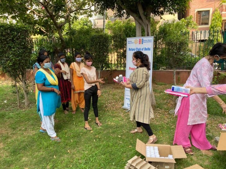 Distributed sanitary napkins and deodorant to 100 ladies